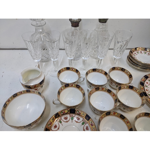 218 - A mixed lot to include some crystal cut glass decanters, two with hallmarked silver collars, a Royal... 