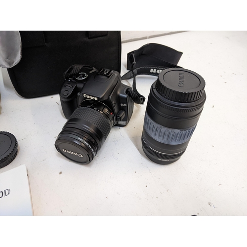 221 - A Canon EOS camera and 58mm and 52mm lenses and accessories
Location: 1-2
If there is no condition r... 