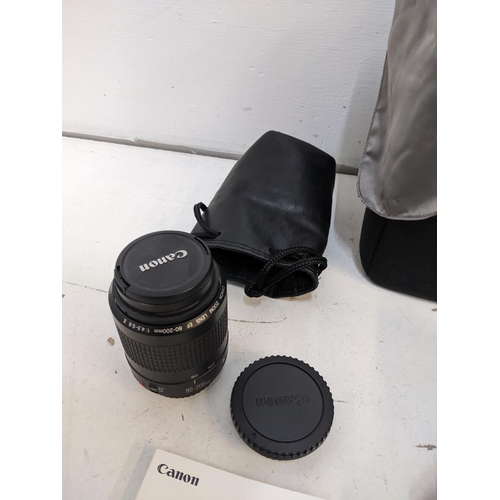 221 - A Canon EOS camera and 58mm and 52mm lenses and accessories
Location: 1-2
If there is no condition r... 