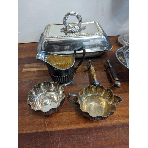 230 - A collection of silver plate and EPNS to include a silver jug, a coffee pot, a pickle fork with a mo... 