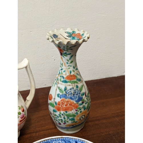 244 - A group of ceramics to include: a Chinese famille rose jar, a namkeen sauce jug, a Japanese vase, ot... 