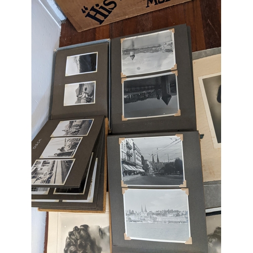 248 - A collection of early 20th century photograph albums along with vintage postcards
Location: 3-1
If t... 