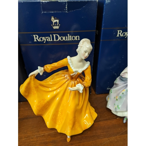 250 - A group of four boxed Royal Doulton figurines to include: No 2937 