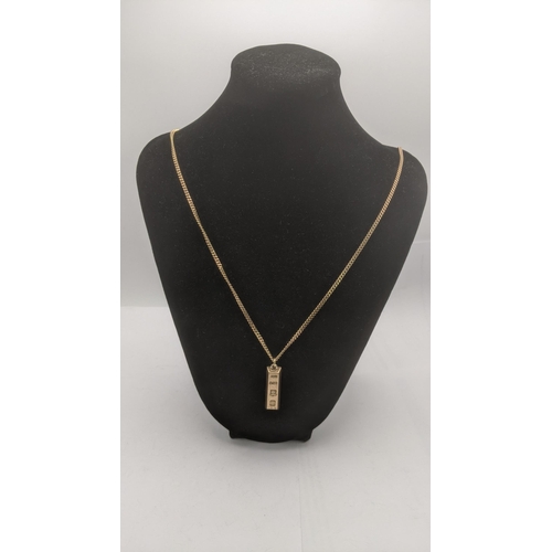 26 - A 9ct yellow gold ingot pendant on a 9ct yellow gold flat curb link chain 60cm L 23.7g
Location:CAB2... 