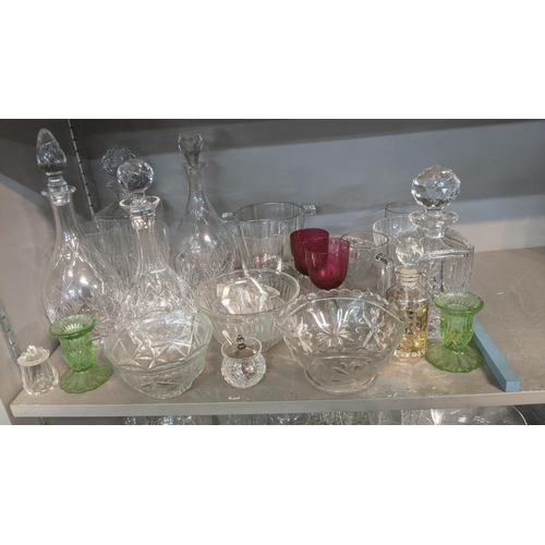 266 - A quantity of crystal cut glassware to include decanters, vases, bowls and drinking glasses together... 