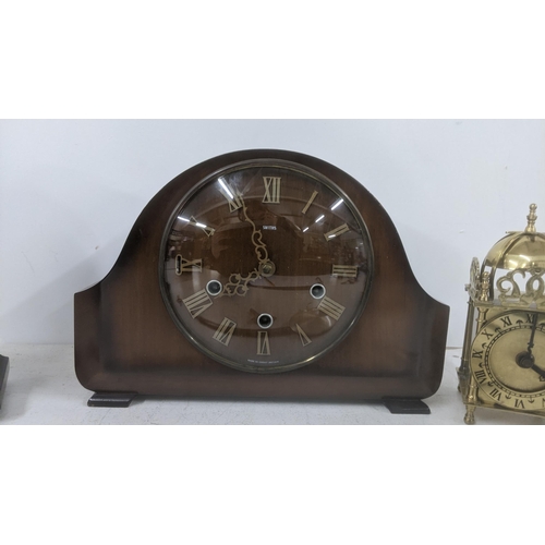 268 - Four clocks to include an Edwardian inlaid mahogany Balloon clock along with a Smith's dining room m... 