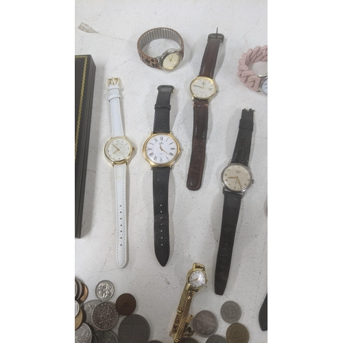 270 - Wrist watches and world coins and banknotes to include two Gents Rotary examples and others together... 