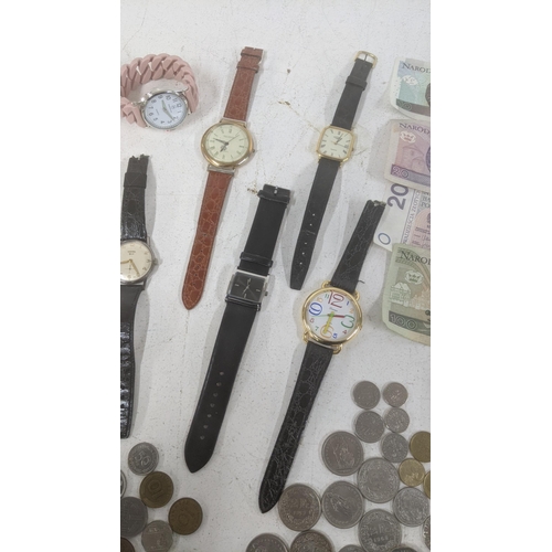 270 - Wrist watches and world coins and banknotes to include two Gents Rotary examples and others together... 