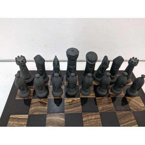 282 - A granite/stone chess board with traditional pieces
Location: RAM
If there is no condition report sh... 