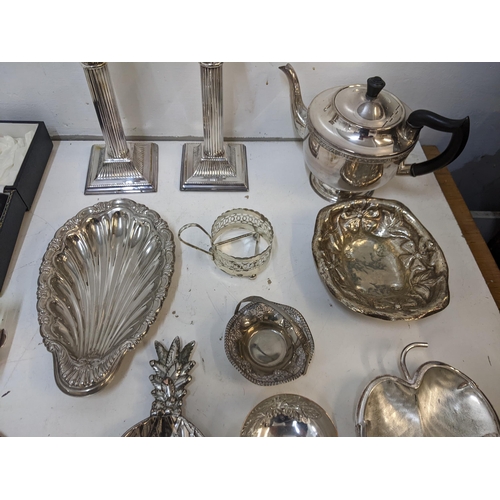 292 - Silver plate to include a pair of Corinthian Capital candlesticks, dishes, tea set and other items
L... 