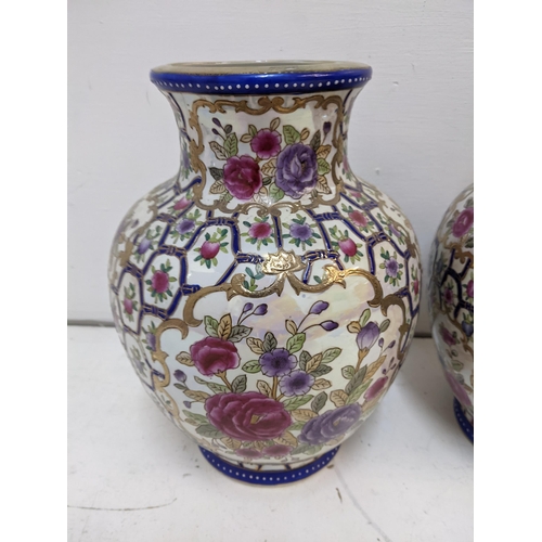 301 - A pair of modern Chinese vases decorated with flowers and fruit
Location: 4.4
If there is no conditi... 