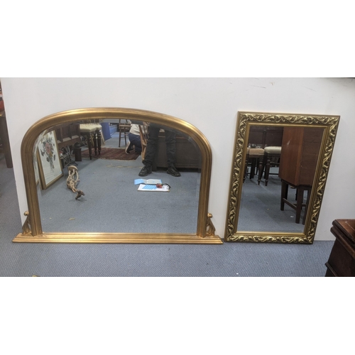 392 - Two mirrors to include a Victorian style arched gilt overmantel example, 124cm x 78cm, a floral exam... 