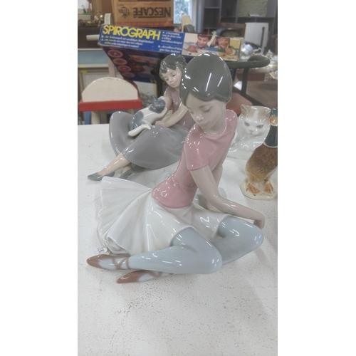 402 - Lladro to include 1357 'Ballet Pink' Lladro Pero dog, together with two Lladro Nao figures and a Bes... 