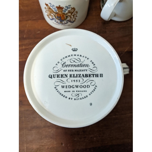 424 - A group of commemorative ceramics to include: a Royal Doulton No 4984 Queen Victoria jug, a Wedgwood... 