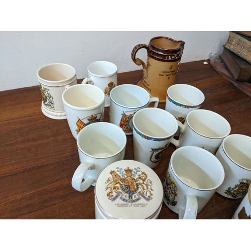 424 - A group of commemorative ceramics to include: a Royal Doulton No 4984 Queen Victoria jug, a Wedgwood... 