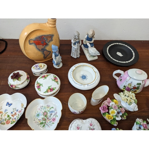 425 - A mixed lot of ceramics to include: floral trinkets, a Dresden figure of a girl and a duck, a Royal ... 