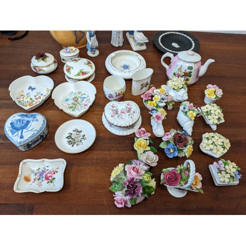 425 - A mixed lot of ceramics to include: floral trinkets, a Dresden figure of a girl and a duck, a Royal ... 