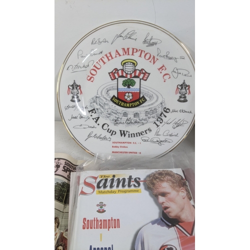 428 - Southampton FC related memorabilia to include: two folders of programmes dating mostly from the late... 