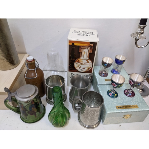 433 - A mixed lot of glass and metalware to include a candelabra, three pewter pint tankards, a boxed Darl... 