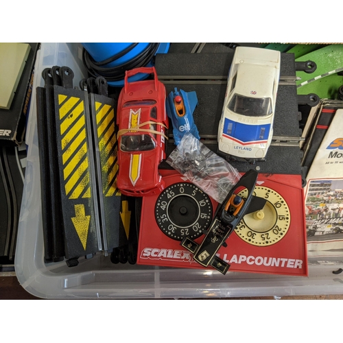 452 - A large quantity of Scalextric model motor racing track, cab, accessories, controllers, magazines an... 