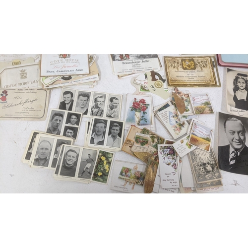 458 - Mixed ephemera to include: two autograph books, signed photographs, cigarette cards and alcohol bott... 