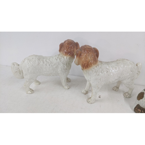 462 - Victorian Staffordshire dogs to include a pair of standing examples 28cm h x 35cm w, together with t... 