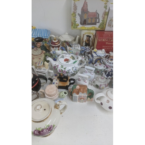 463 - A large quantity of mainly ceramic teapots, some boxed to include examples from Whittard of Chelsea,... 