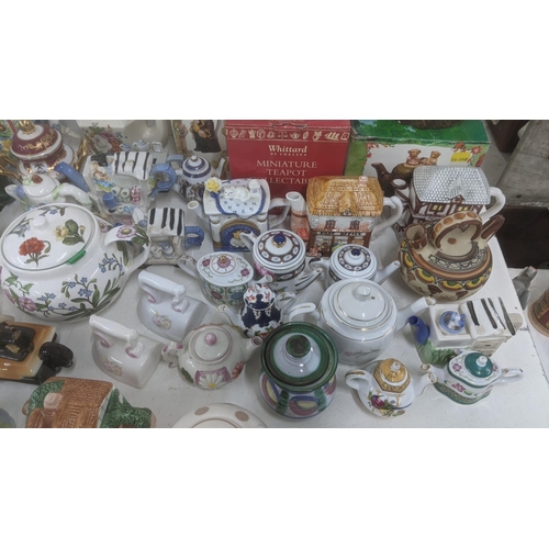 463 - A large quantity of mainly ceramic teapots, some boxed to include examples from Whittard of Chelsea,... 