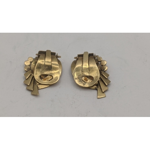 54 - A pair of yellow metal clip on earrings tested as 14ct gold; 4.6g
Location: CAB1
Location:
If there ... 