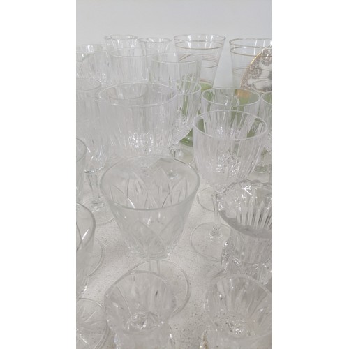 464 - A mixed lot to include a variety of crystal cut glass drinking vessels, together with mixed Masons I... 