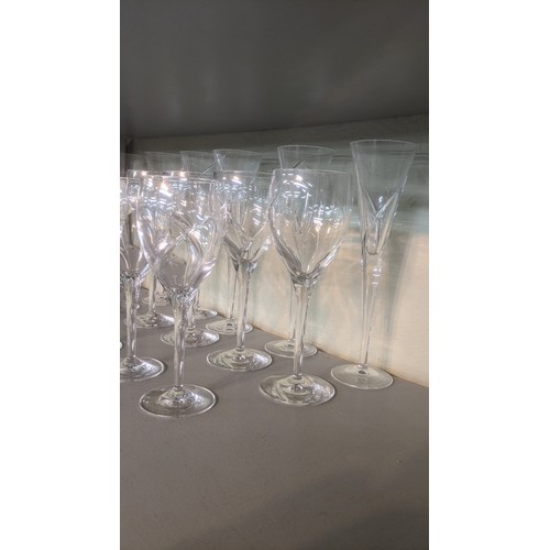 466 - Eighteen Waterford Siren drinking glasses comprising 6 Champagne, red and white glasses A/F
Location... 