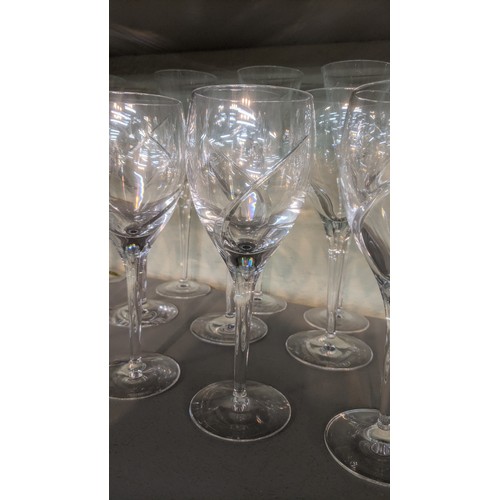 466 - Eighteen Waterford Siren drinking glasses comprising 6 Champagne, red and white glasses A/F
Location... 