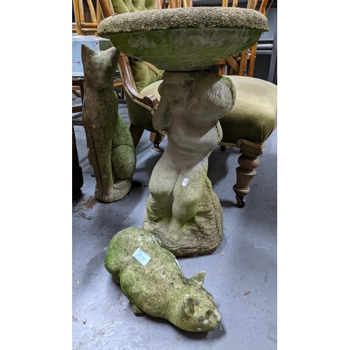 193 - A group of garden weathered concrete ornaments to include a bird bath having circular top supported ... 