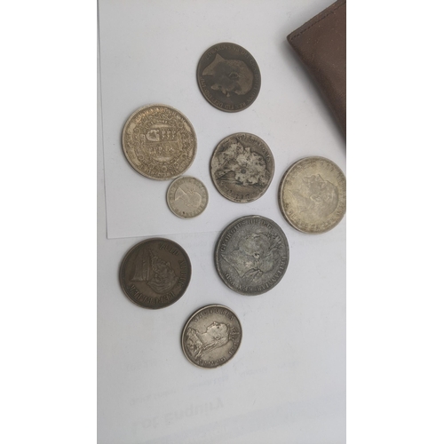 79 - A small collection of mostly British coins to include: William III 1696 half crown, Victoria 1887 Ju... 