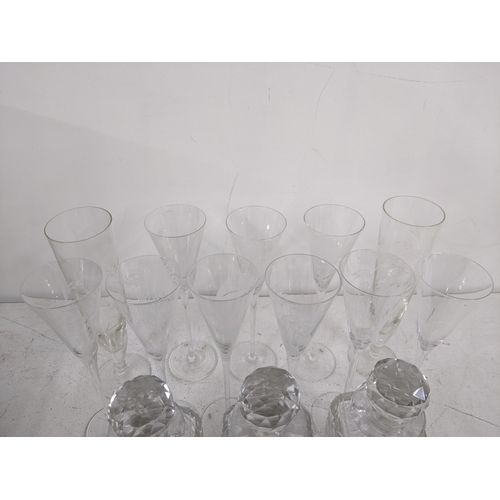 376 - A collection of glassware to include three 20th century crystal cut decanters, a set of six liqueur ... 