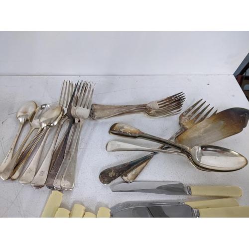 377 - A collection of mixed silver plated flatware to include butter knives, serving spoons and others, al... 