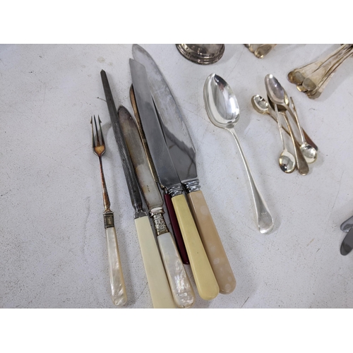 377 - A collection of mixed silver plated flatware to include butter knives, serving spoons and others, al... 