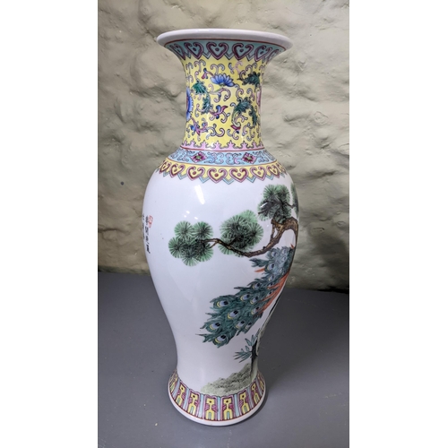 396 - A 20th century Chinese famille rose vase decorated with a peacock on a white ground Location: 2.1
If... 