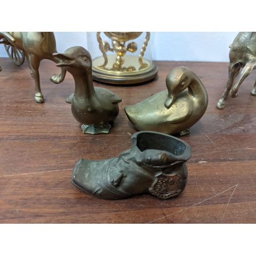 444 - Bronze items to include a pair of horses with carts, two geese, a boot with the Chester City crest, ... 