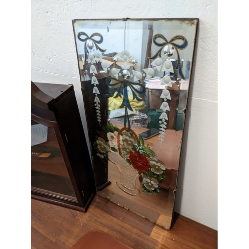 445 - A mixed lot to include two vintage typewriters, a display cabinet, a fire screen, and a mirrored wal... 