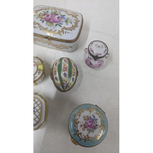 468 - A group of Limoges trinkets and small dressing table box together with one other along with a Limoge... 