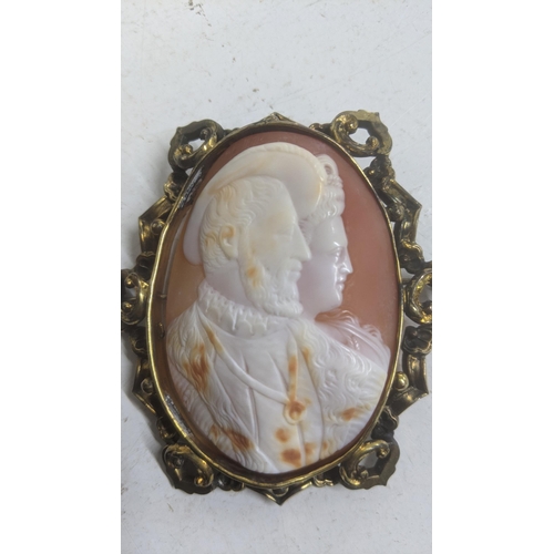 473 - A Victorian Cameo depicting husband and wife, of large proportions, mounted in a gold plated frame
L... 