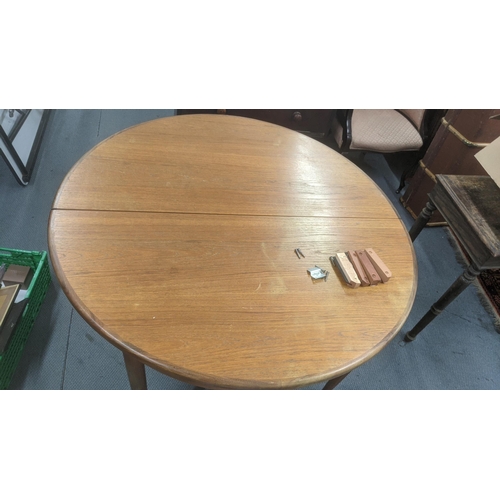 486 - A G-plan Fresco range extending dining table A/F, 75cm h x 121cm dia
Location: A3B
If there is no co... 