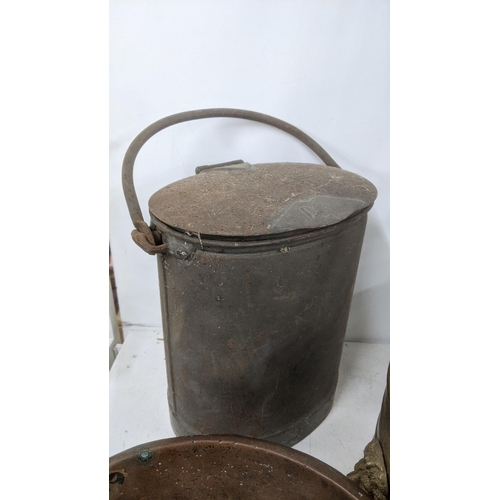 489 - A mixed lot mostly metalware to include a cream can, a copper and brass planter/bucket with twin lio... 