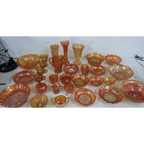 497 - A collection of Marigold carnival glass to include bowls, goblets, vases, jugs and other items Locat... 