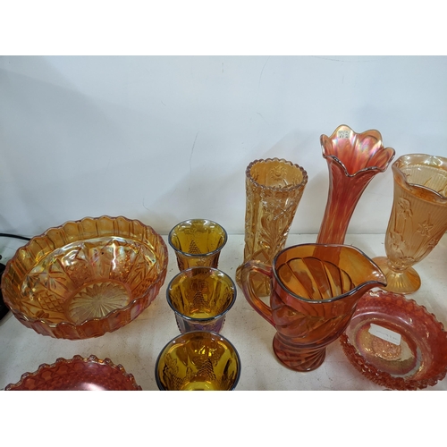 497 - A collection of Marigold carnival glass to include bowls, goblets, vases, jugs and other items Locat... 