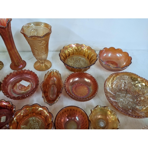 497 - A collection of Marigold carnival glass to include bowls, goblets, vases, jugs and other items Locat... 