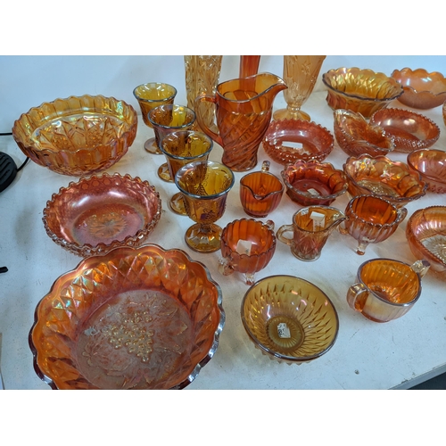 497 - A collection of Marigold carnival glass to include bowls, goblets, vases, jugs and other items Locat... 