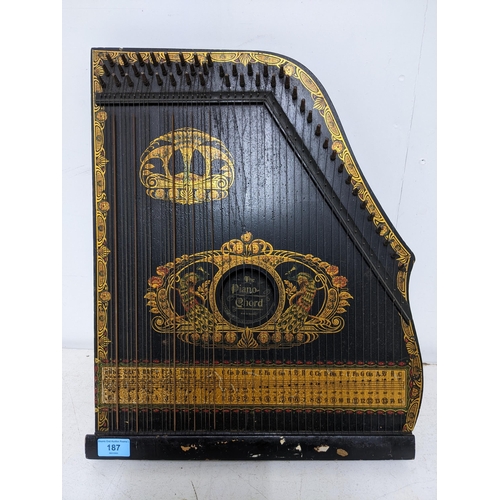 187 - A German piano chord instrument, ebonized wood with secessionist gilt and coloured paint decoration,... 