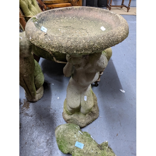 193 - A group of garden weathered concrete ornaments to include a bird bath having circular top supported ... 